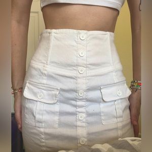 all white BEBE pencil skirt, size 00. its giving business casual.